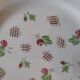 11 dinner plates decorated with stylized roses. 1950s. 11 dinner plates