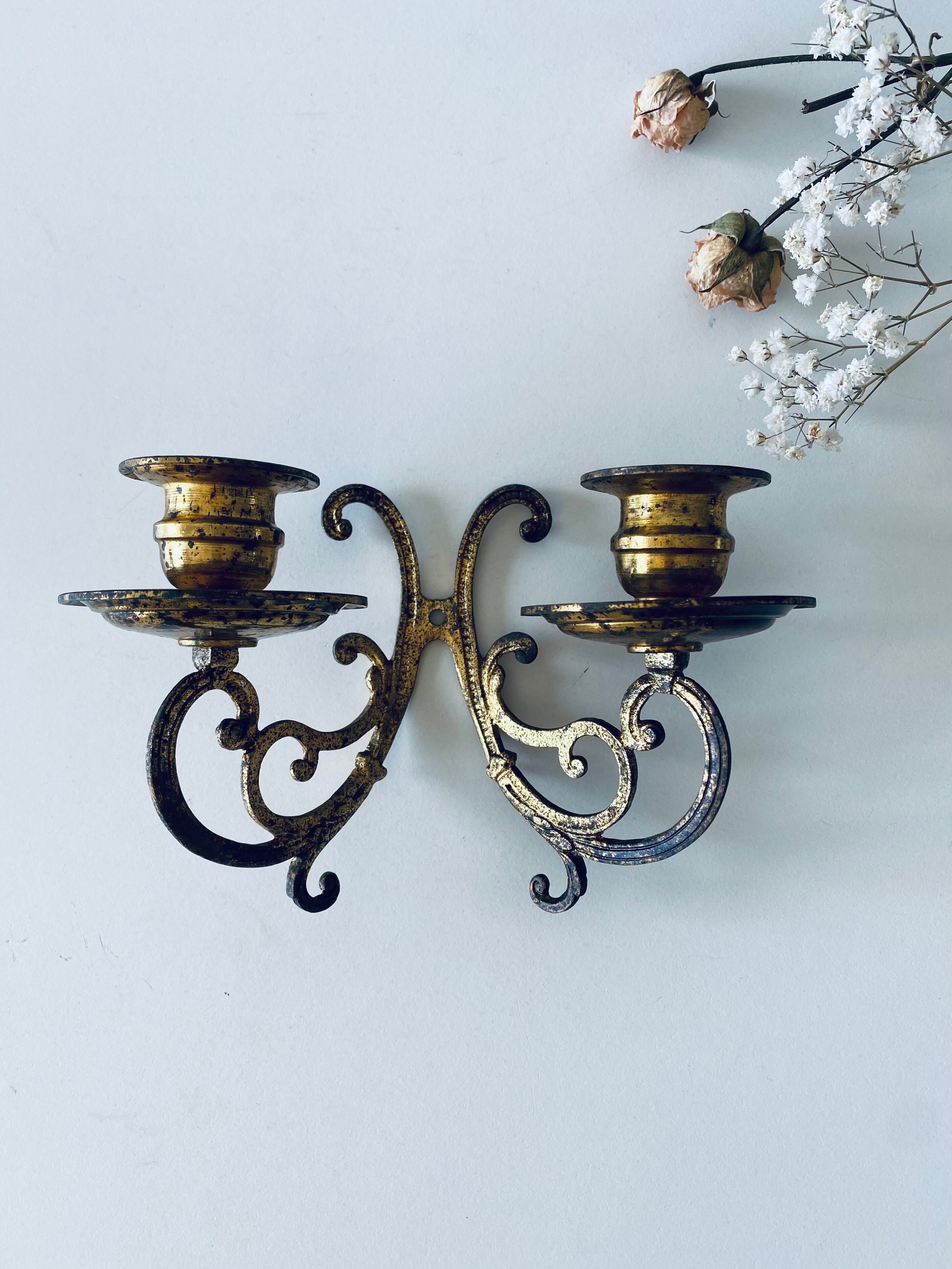 Old wall candle holder in golden brass