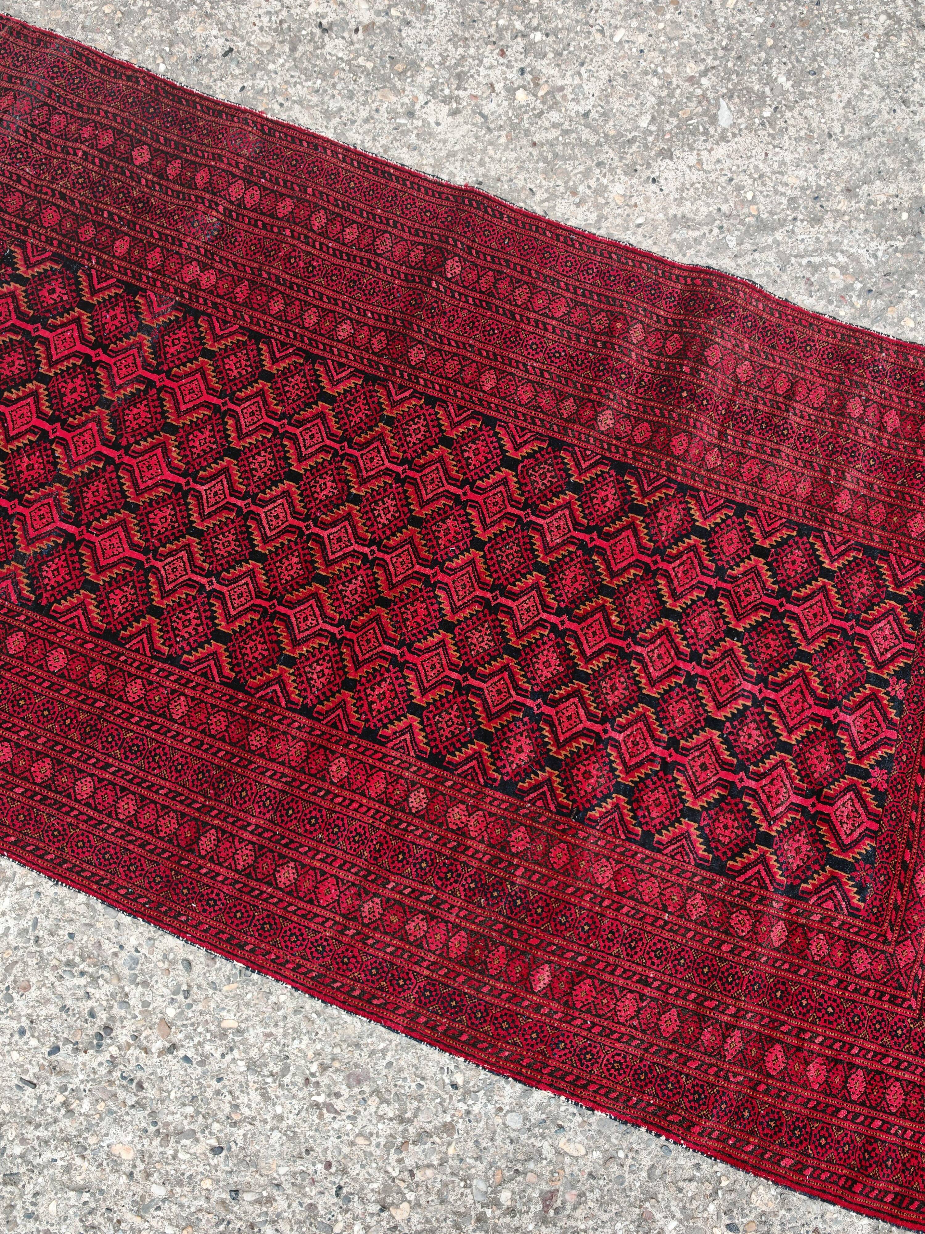 Vintage Baluch carpet handmade from natural wool, Afghanistan 1960.