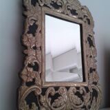 Mirror with embossed metal décor