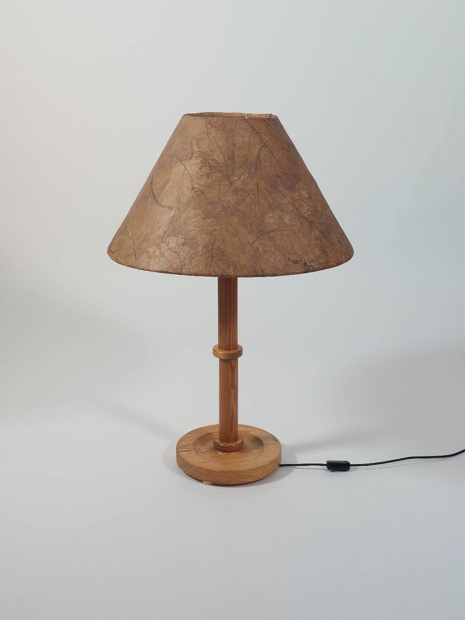 Vintage pine table or floor lamp with a shade made of real leaves.