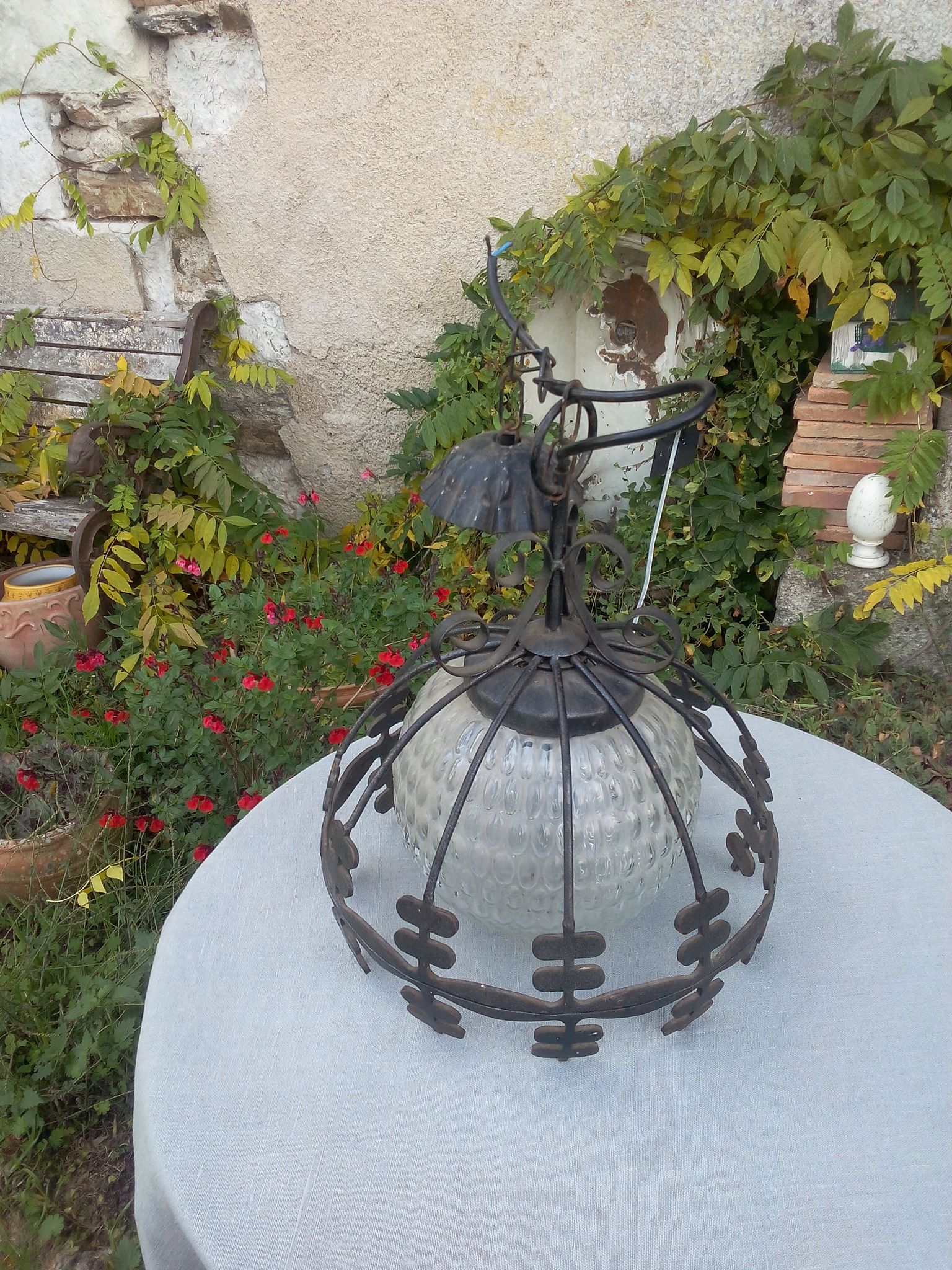 Industrial glass and wrought iron lamp