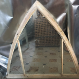 Metal mirror in the shape of an ogive