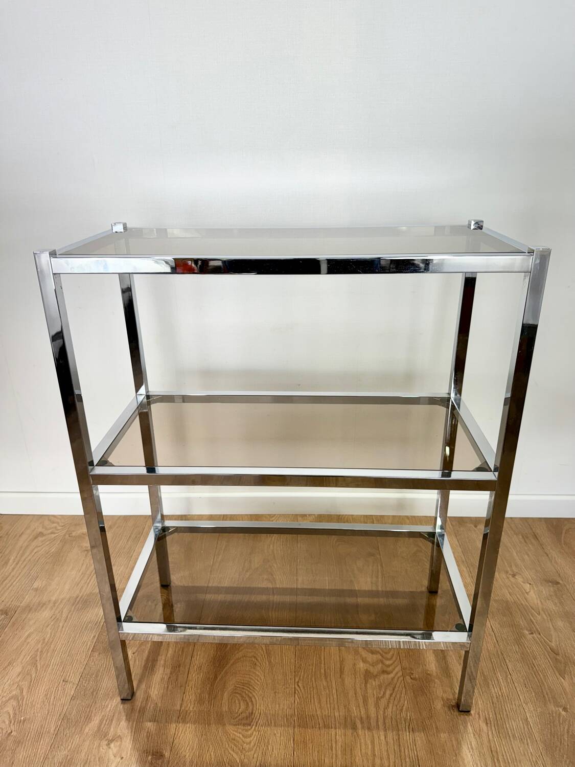 Stainless steel shelf and smoked glass