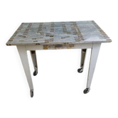 Workshop serving table with 1 drawer in metal covered with pieces of pl meter