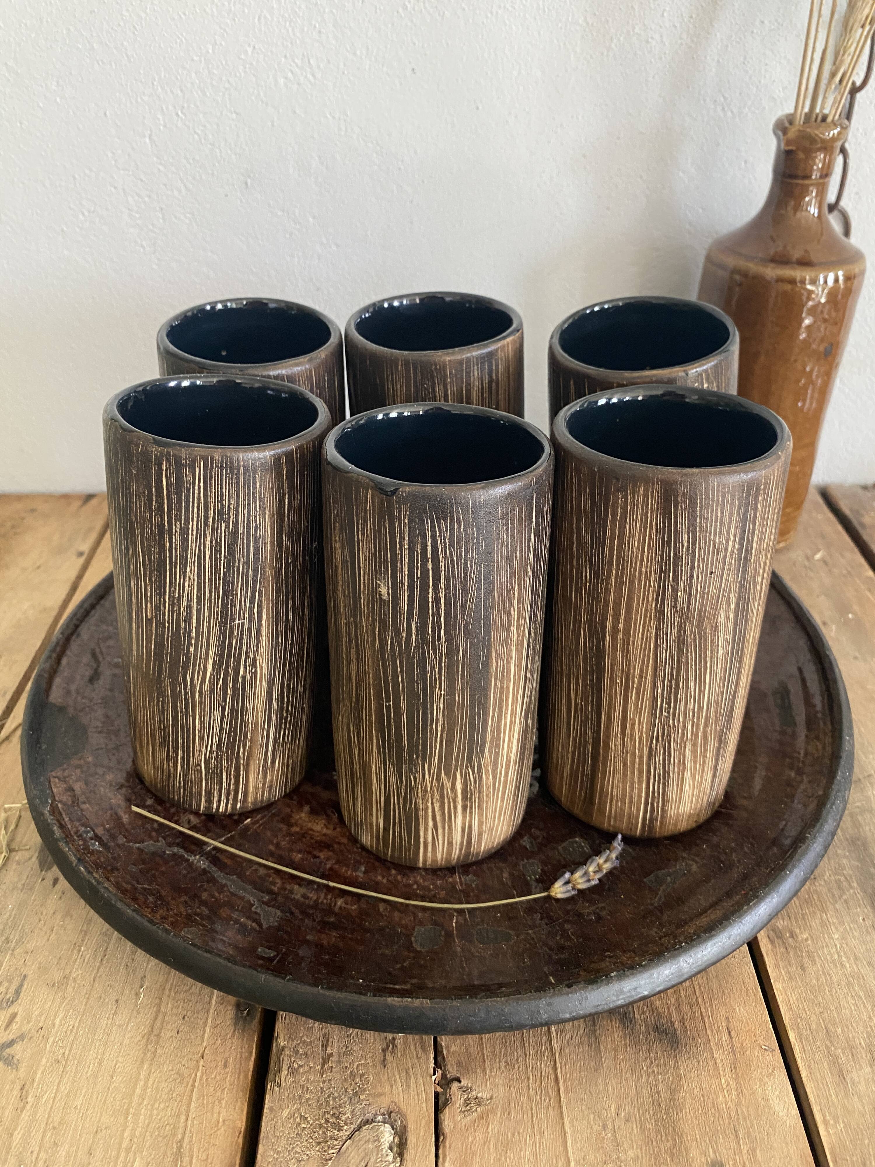 Six terracotta glasses, matt and glazed