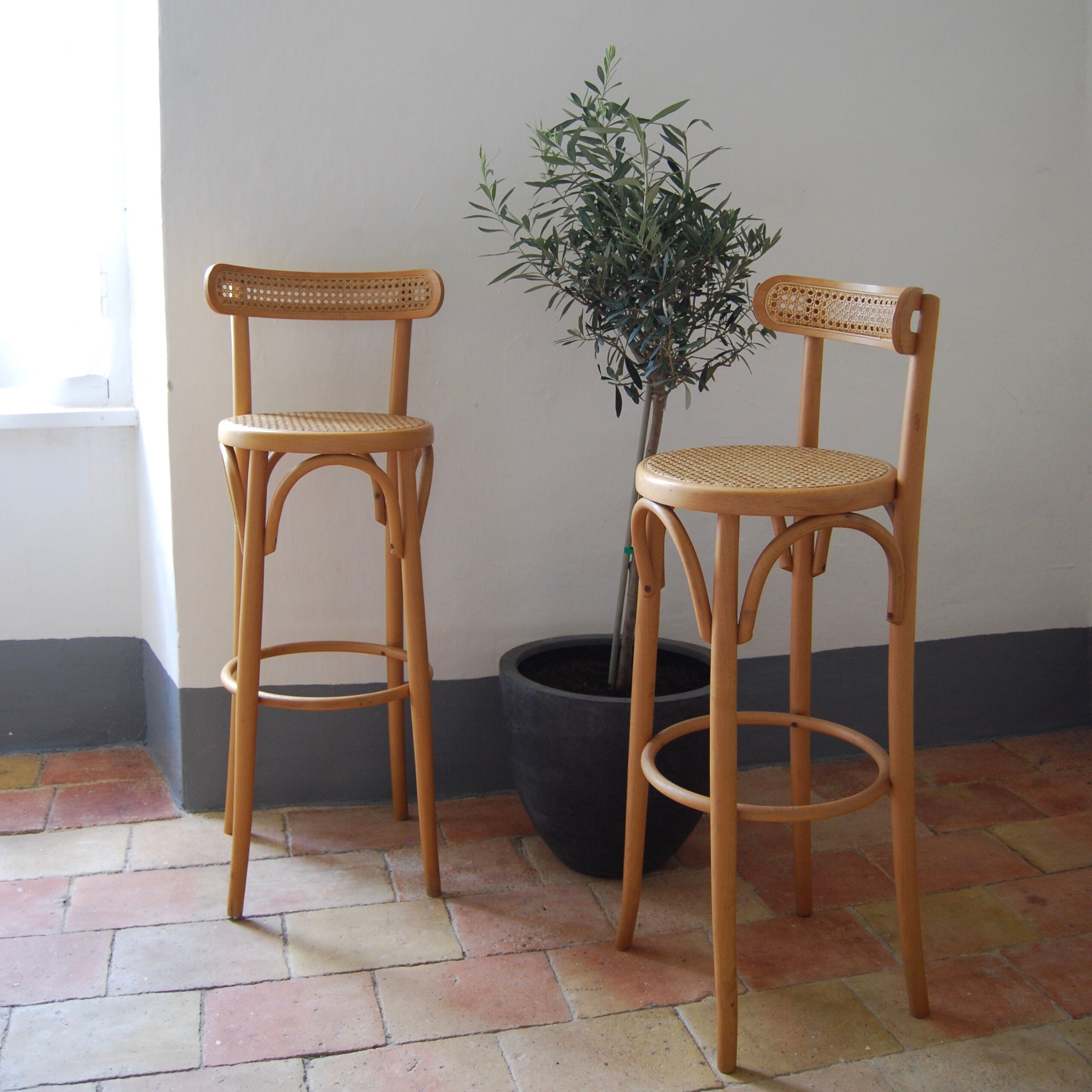 Wooden bar stools and cane
