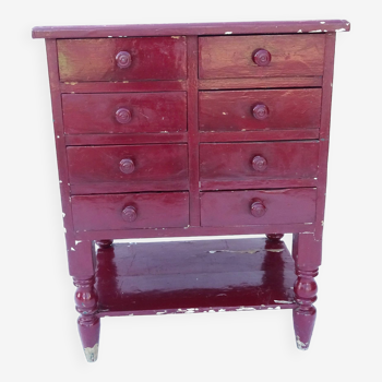 Vintage chest of drawers in burgundy red solid wood.