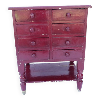 Commode vintage en bois massif rouge bordeaux.