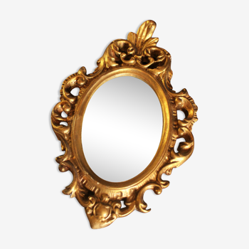 Miroir doré travaillé ovale baroque