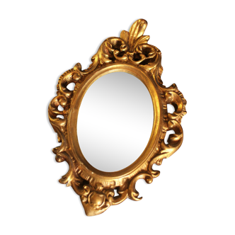Baroque oval worked golden mirror
