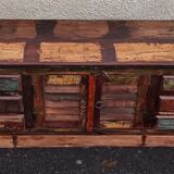 Furniture low in colorful wood. 12 drawers and 1 door