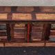 Furniture low in colorful wood. 12 drawers and 1 door