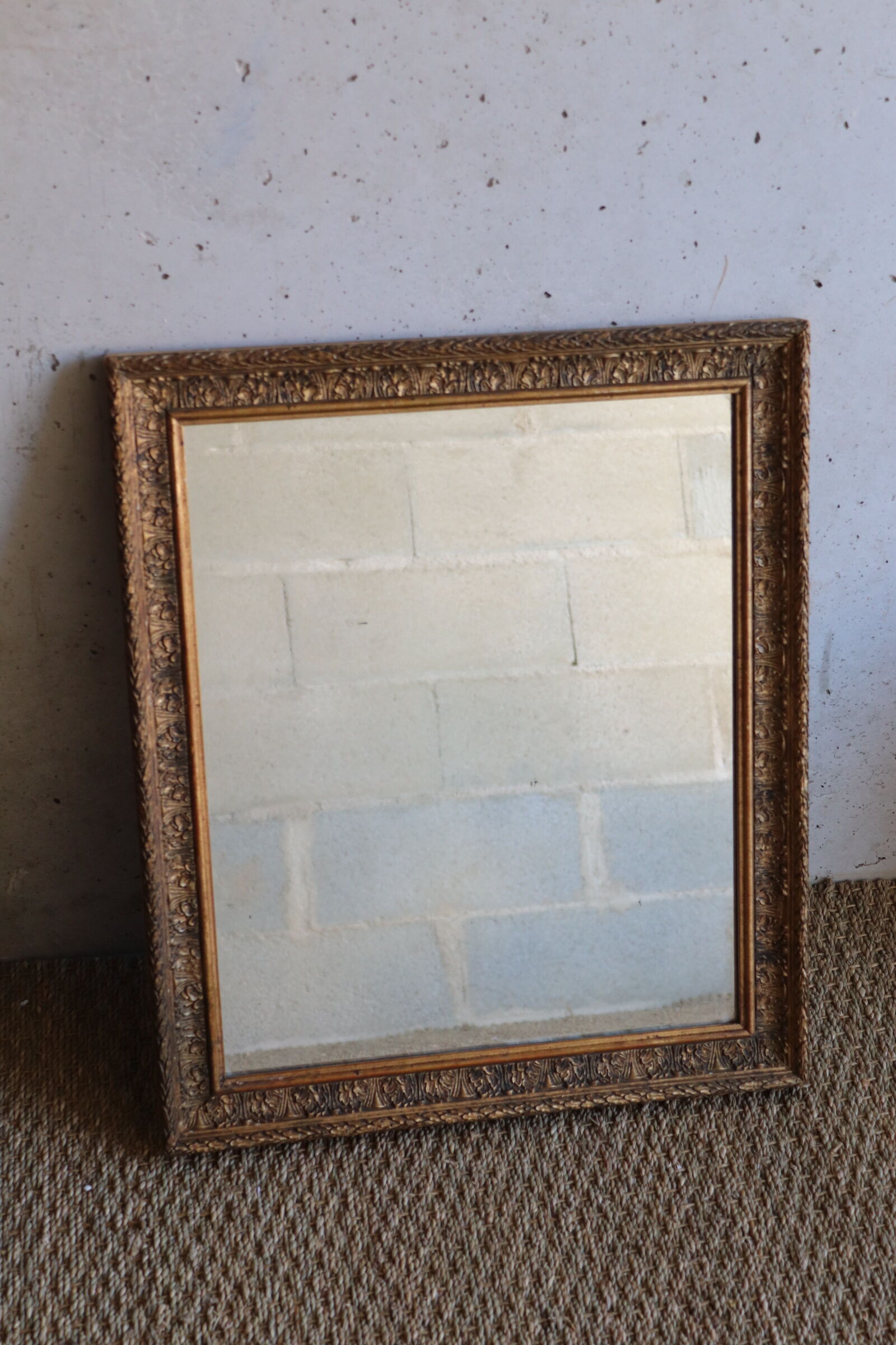 Antique mirror in wood and stucco