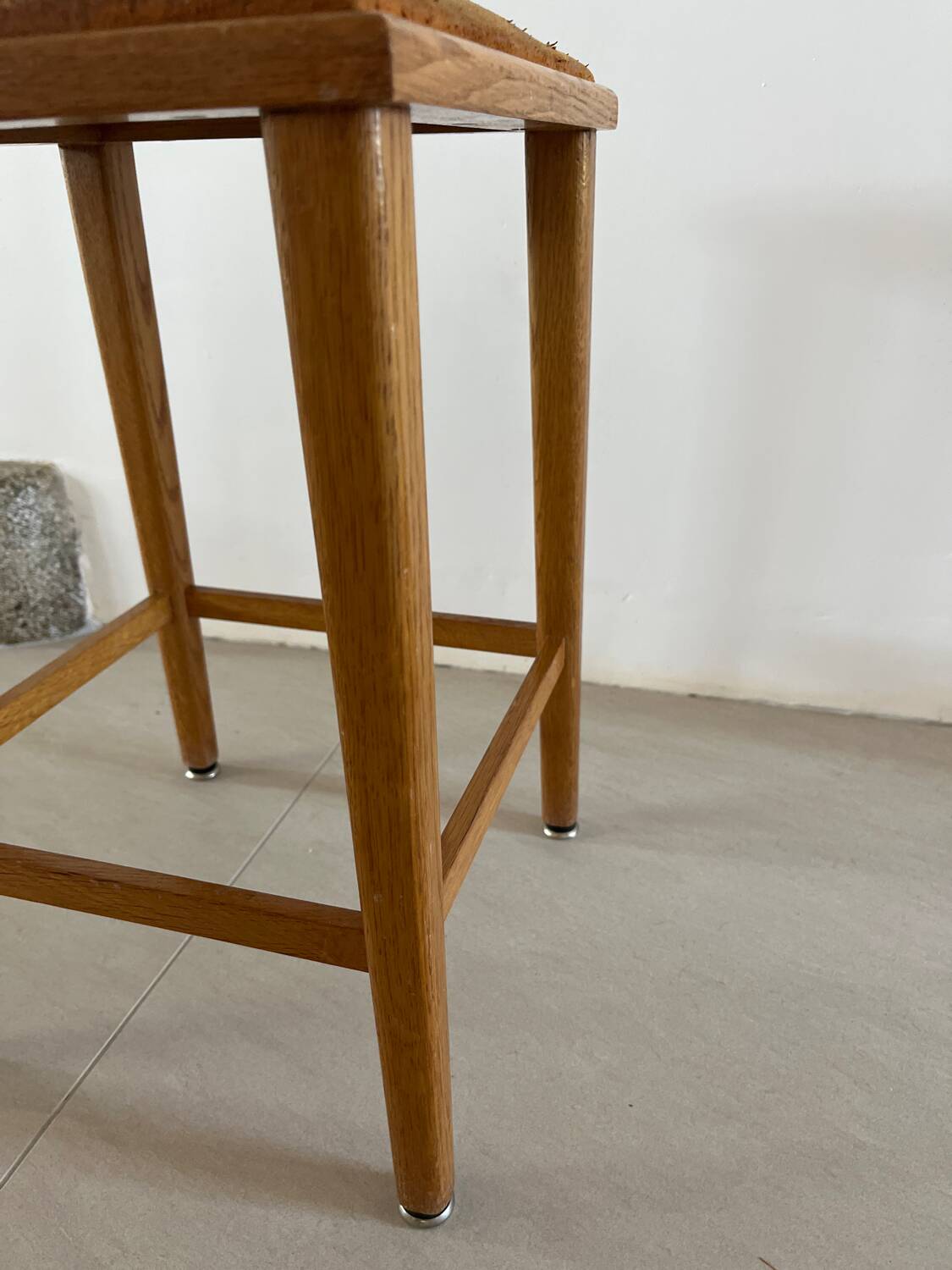 Vintage stool from the 60s with aged leather seat