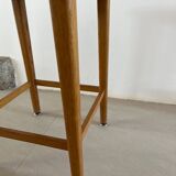 Vintage stool from the 60s with aged leather seat