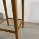 Vintage stool from the 60s with aged leather seat