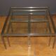 Coffee table and its steel and glass wiggles around 1970