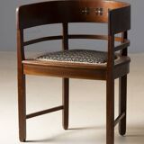 Central European armchair from the early 20th century with an inlaid backrest.