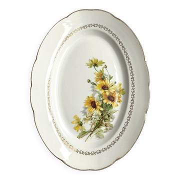 Antique oval plate from Gien with white and yellow daisies and gilding.