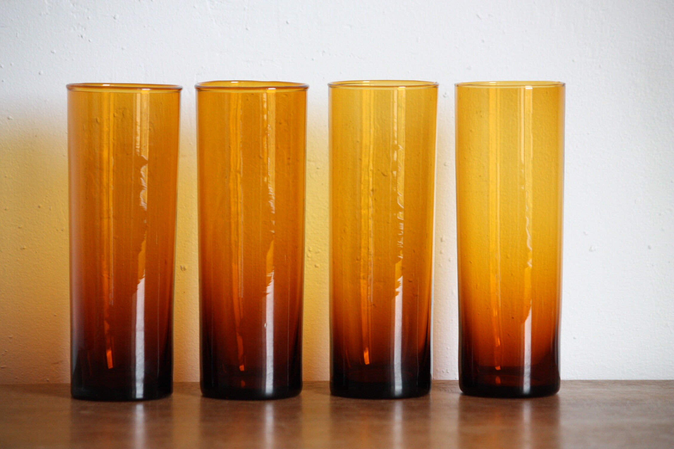 4 amber glasses with orangeade