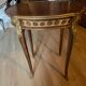 Living room table in Louis XV-Louis XVI transitional style with marquetry and bronze.