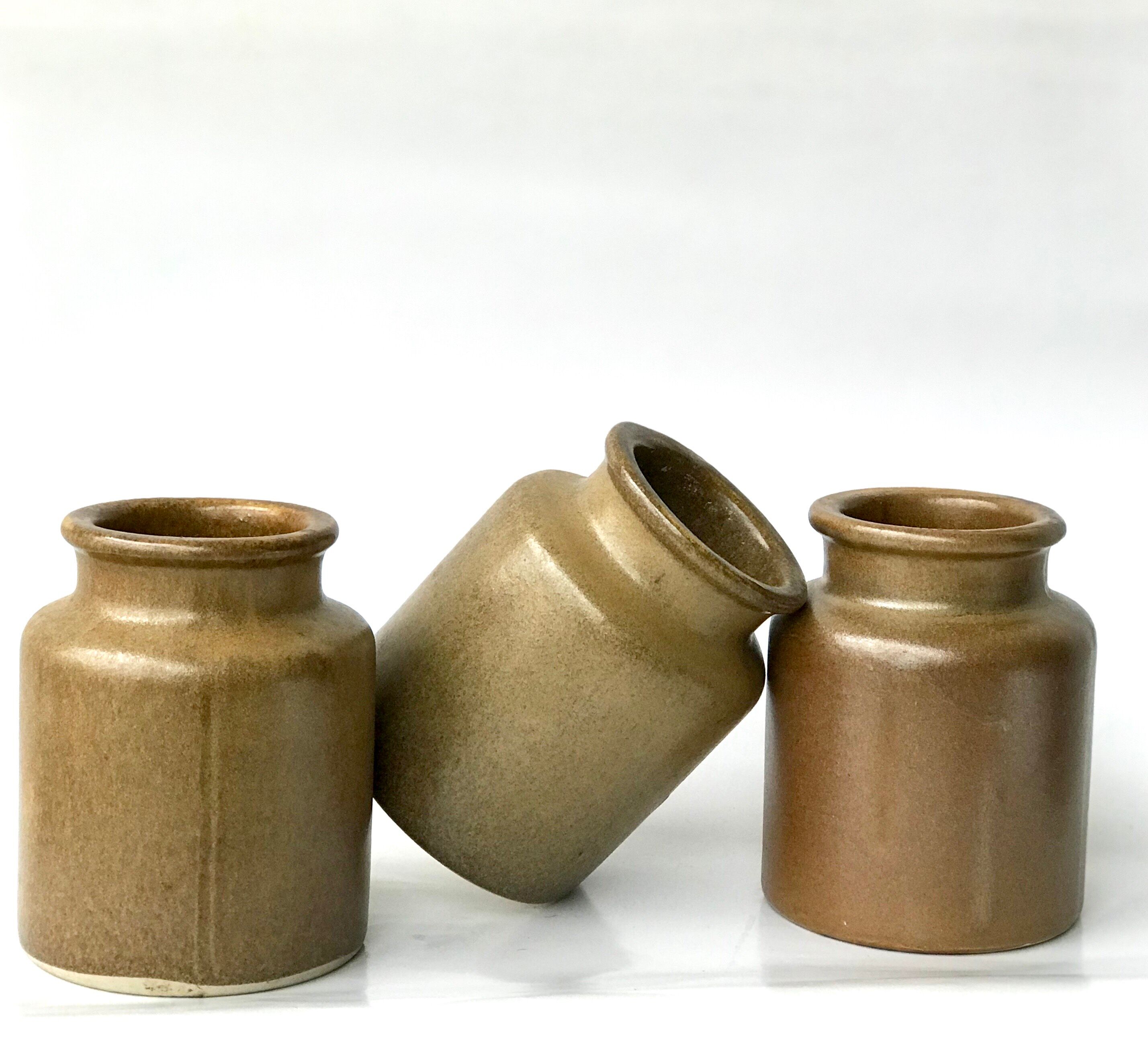 Set of 3 varnished sandstone pots
