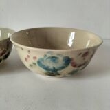 Two large vintage bowls in pastel decor on mini pedestals.