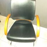 Chairs in leather, walnut and chrome