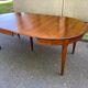 Round extendable dining table Louis XVI in cherry wood from the 1960s.