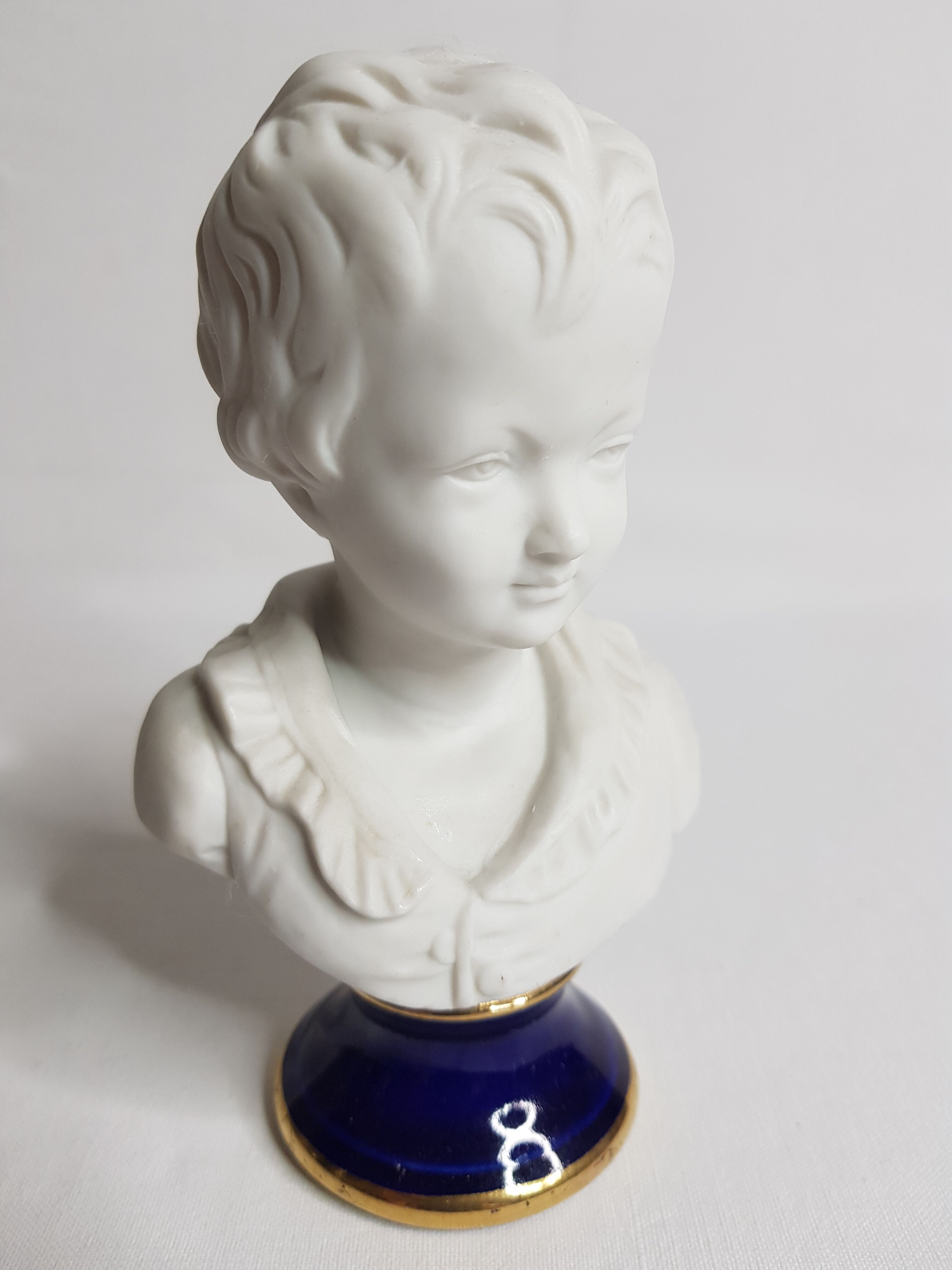 Porcelain biscuit bust, child, Alexandre Brongniart after Houdon