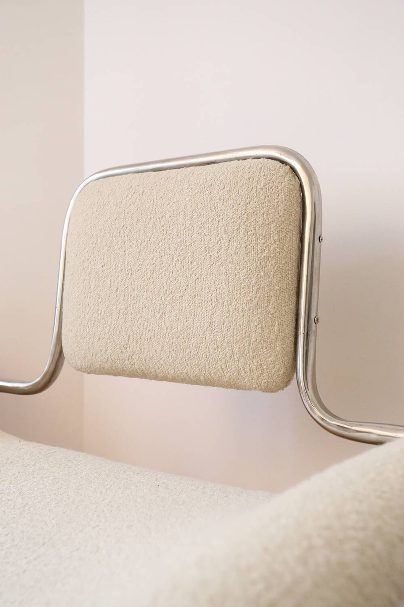 Armchair in ecru wool and stainless steel