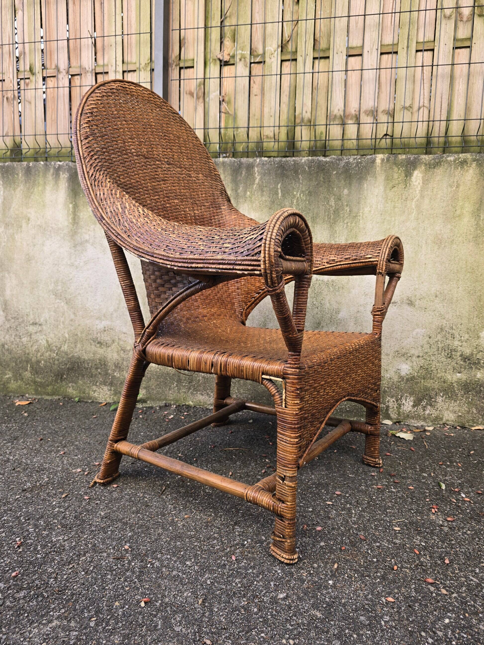 Arts & Crafts armchair in wicker and rattan attributed to Dryad & Co, UK, circa 1920.