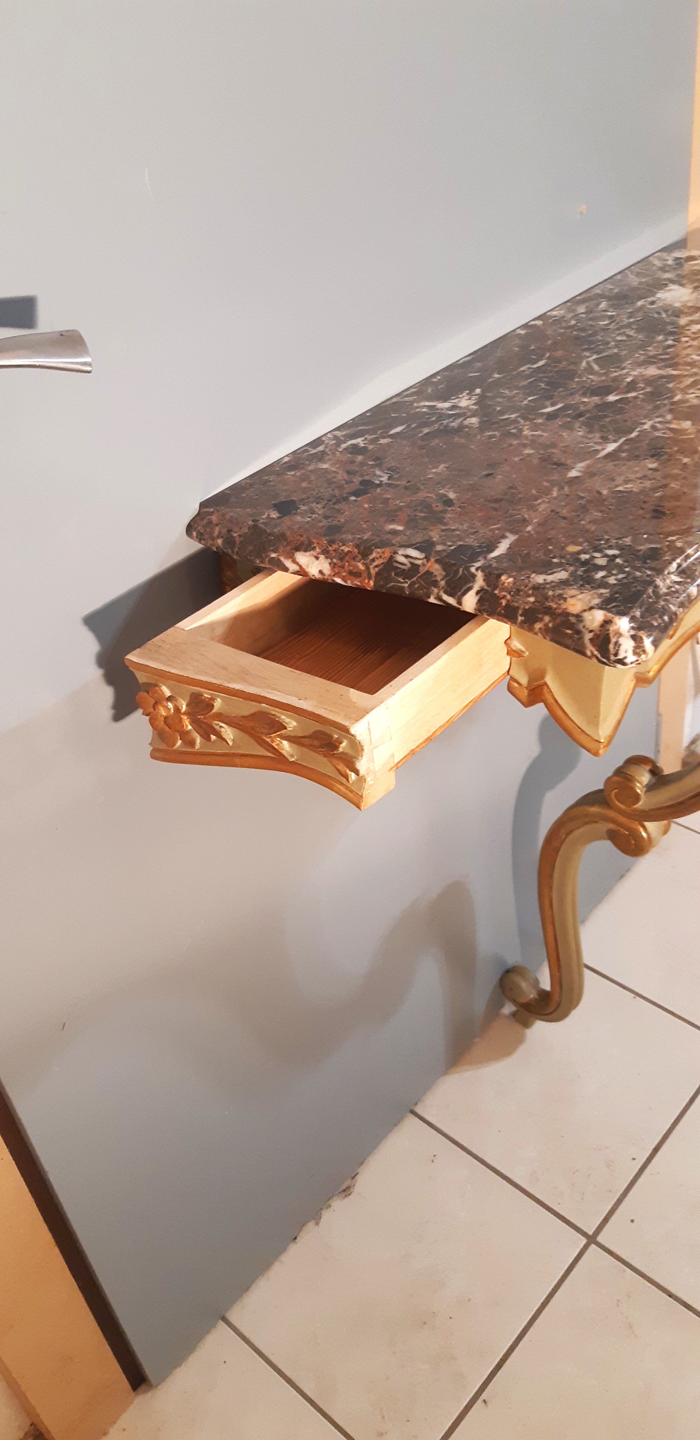 Louis XV style wall lamp console, twentieth century, wood and gilded stucco marble top