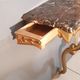 Louis XV style wall lamp console, twentieth century, wood and gilded stucco marble top