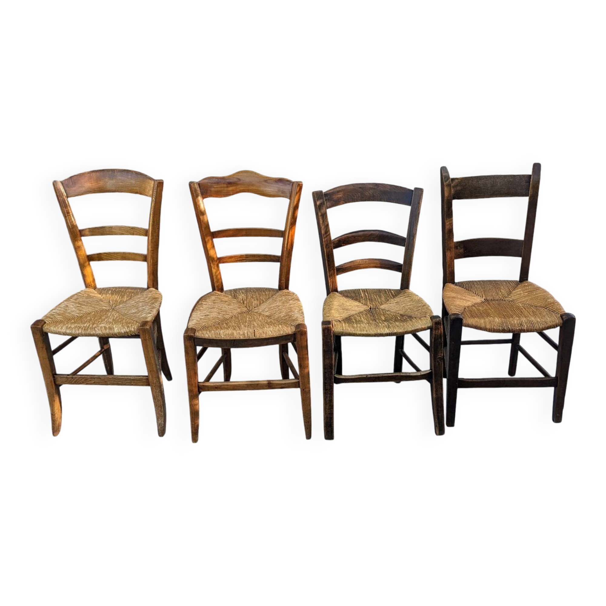 4 mismatched wood and straw chairs