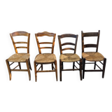 4 mismatched wood and straw chairs