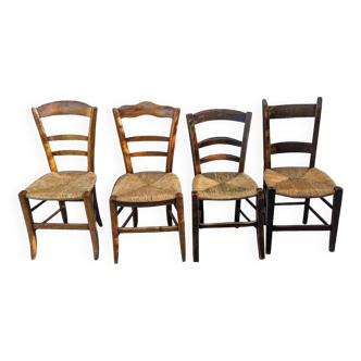 4 mismatched wood and straw chairs