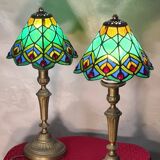 Pair of art nouveau bronze lamps, Tiffany-style glass lampshades
