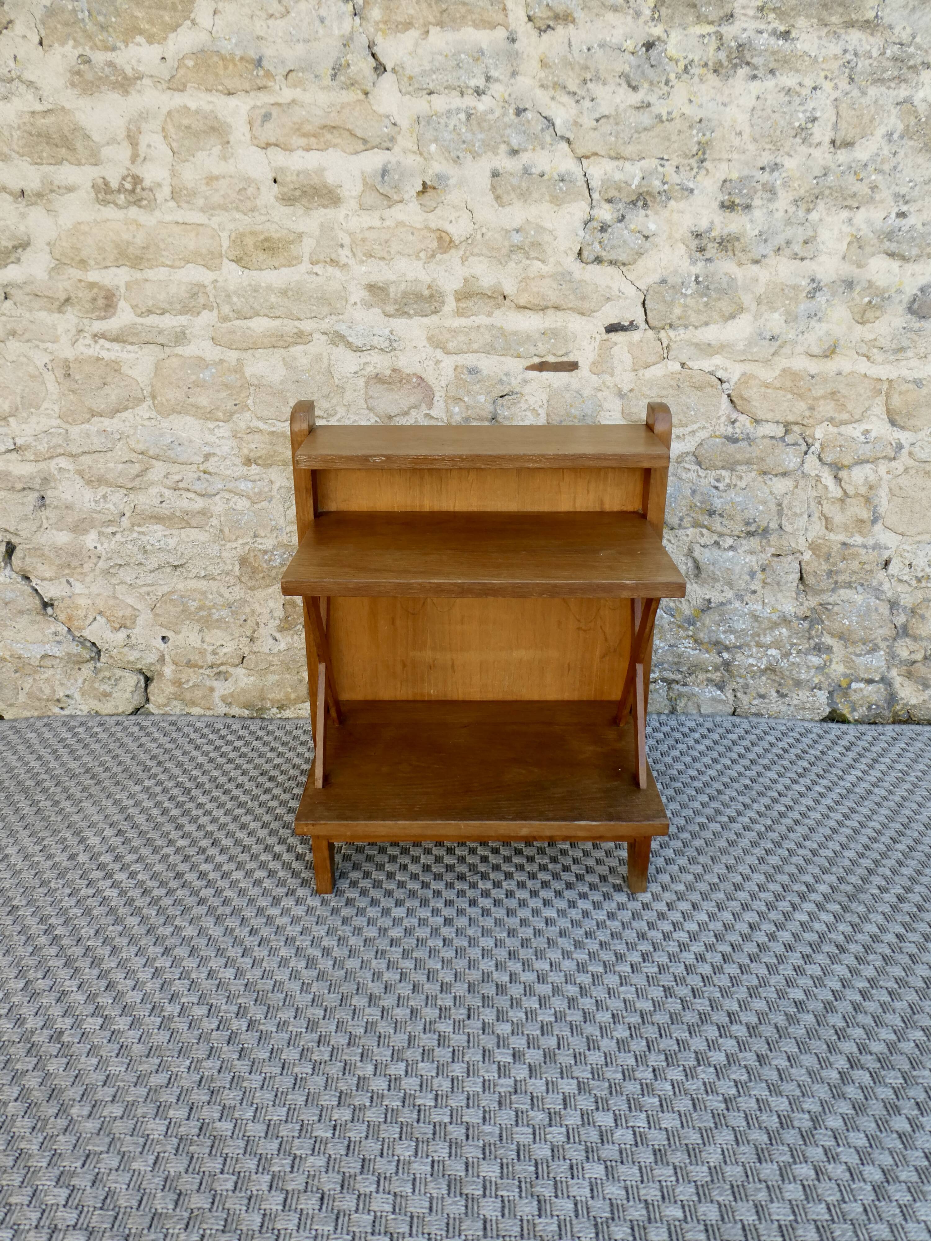 Light wood bedside table with crossbars and 3 shelves, around 1950.