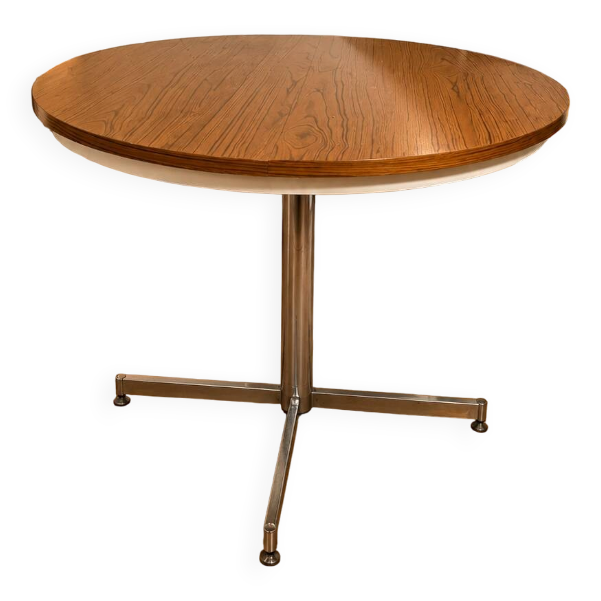 Extendable round table with a space age vintage mid-century formica top.