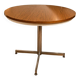 Extendable round table with a space age vintage mid-century formica top.