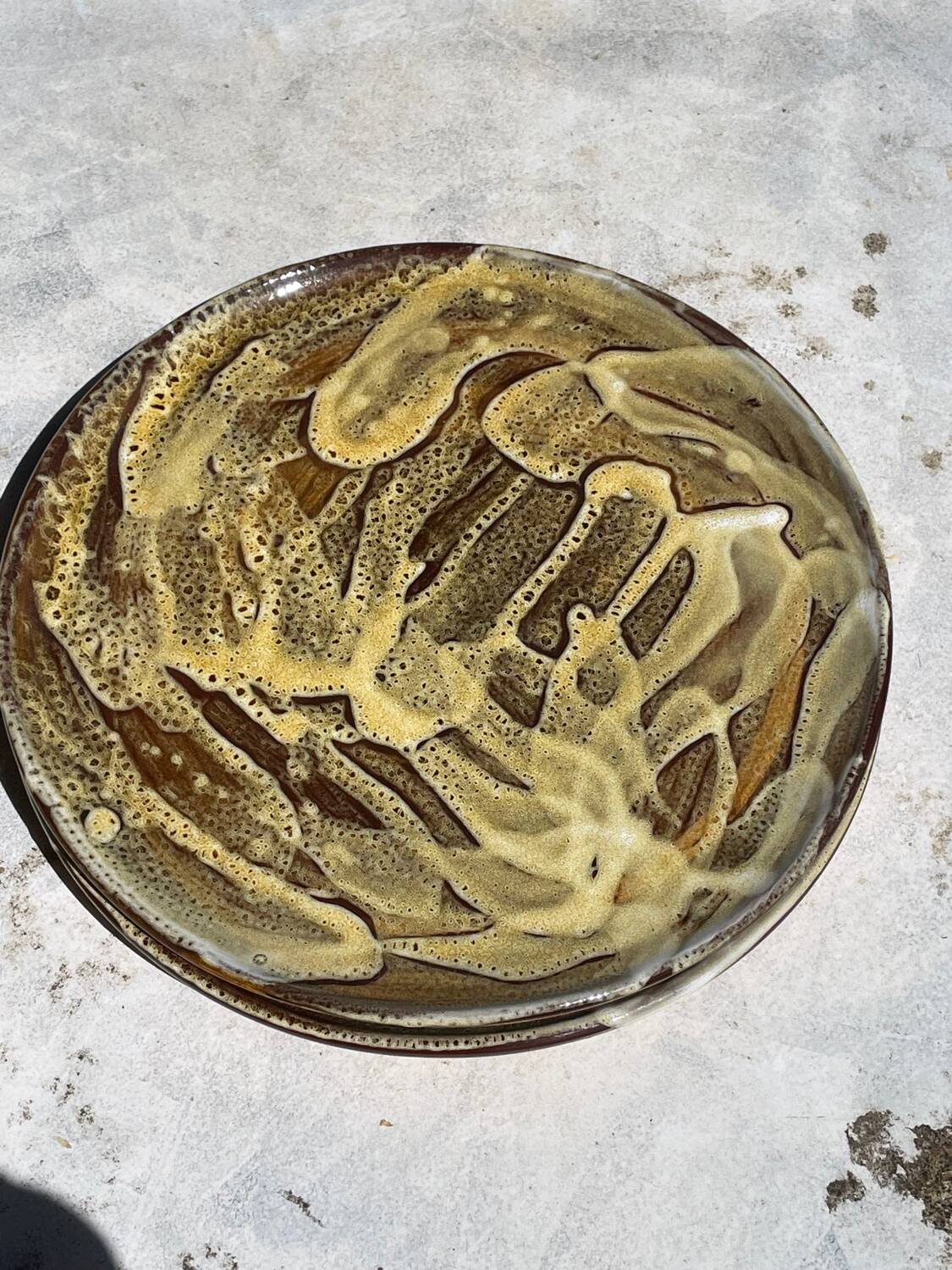 Pair of green glazed stoneware ceramic plates