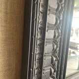 Black carved wooden mirror
