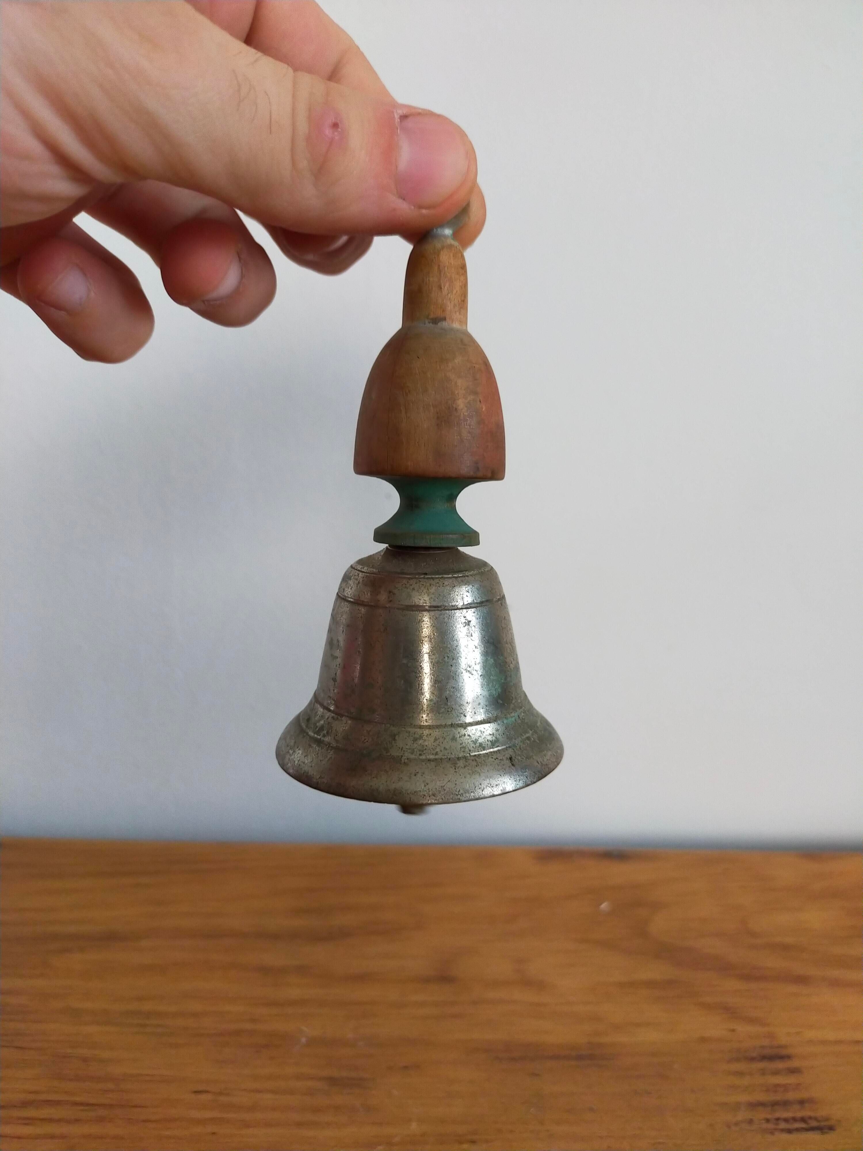 Vintage metal bell and wooden handle