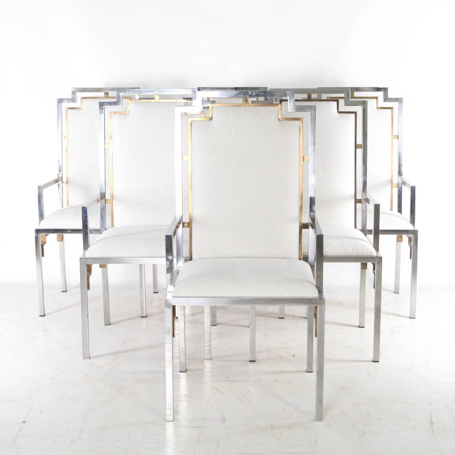 Set of 6 armchairs in stainless steel and brass.
