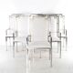 Suite de 6 fauteuils en inox et laiton
