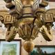 Golden wooden chandelier with crystal pendants from the 19th century.
