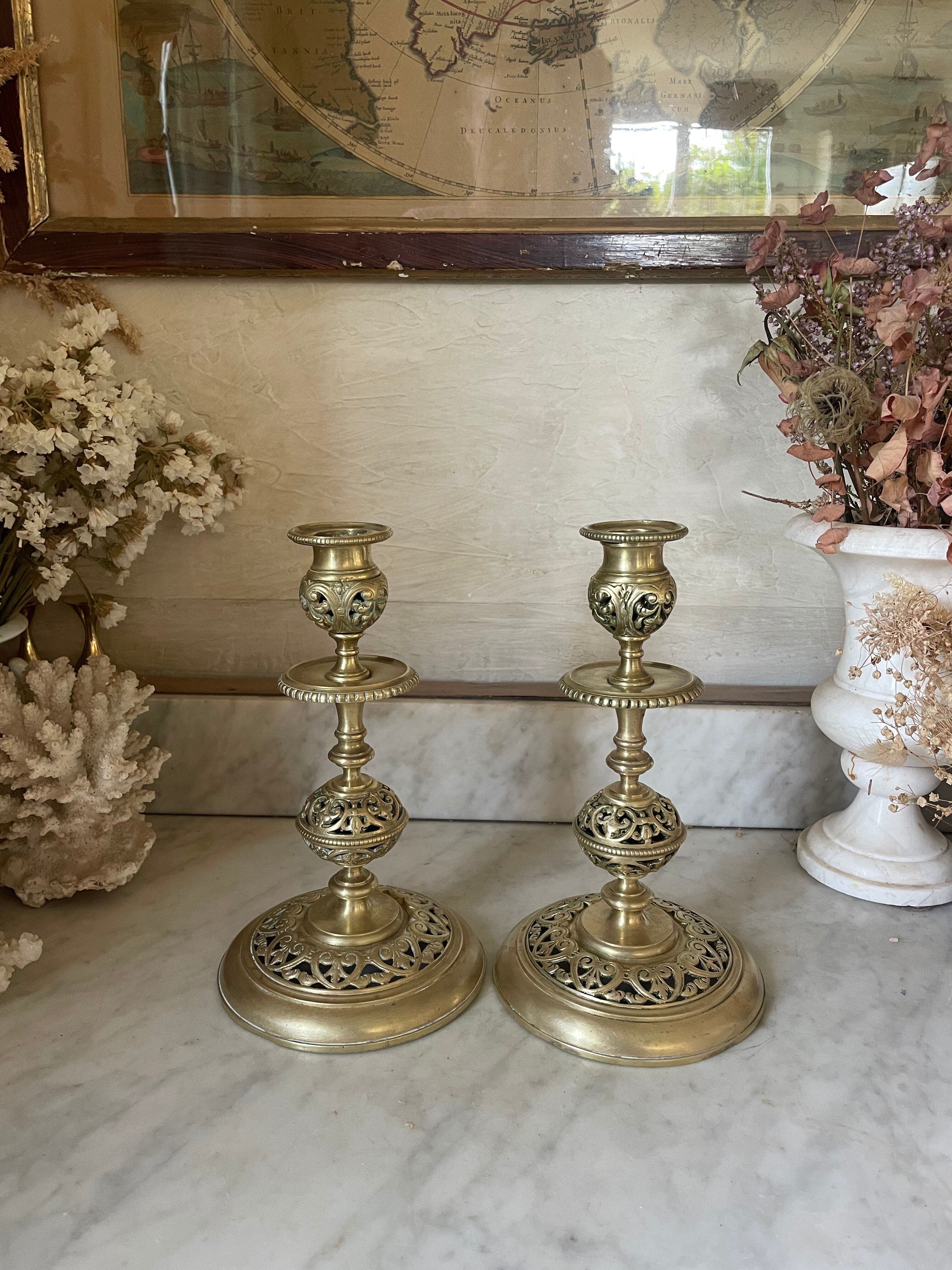 pair of openwork gilded brass candlesticks from the 19th century