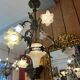 19th century brass and bronze chandelier, Napoleon III, illuminated by 6 tulips and a central globe